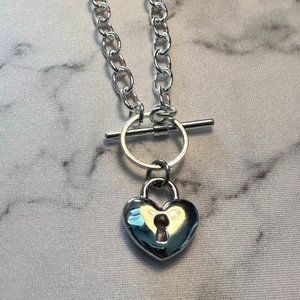 Silver plated 16" toggle chain with puffed heart with keyhole charm
